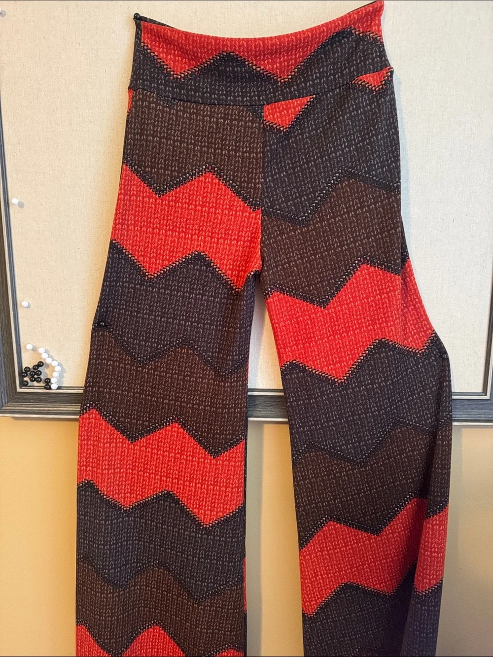 Si Wangs brand stretch bell bottom pants made from a polyester blend.  Size med